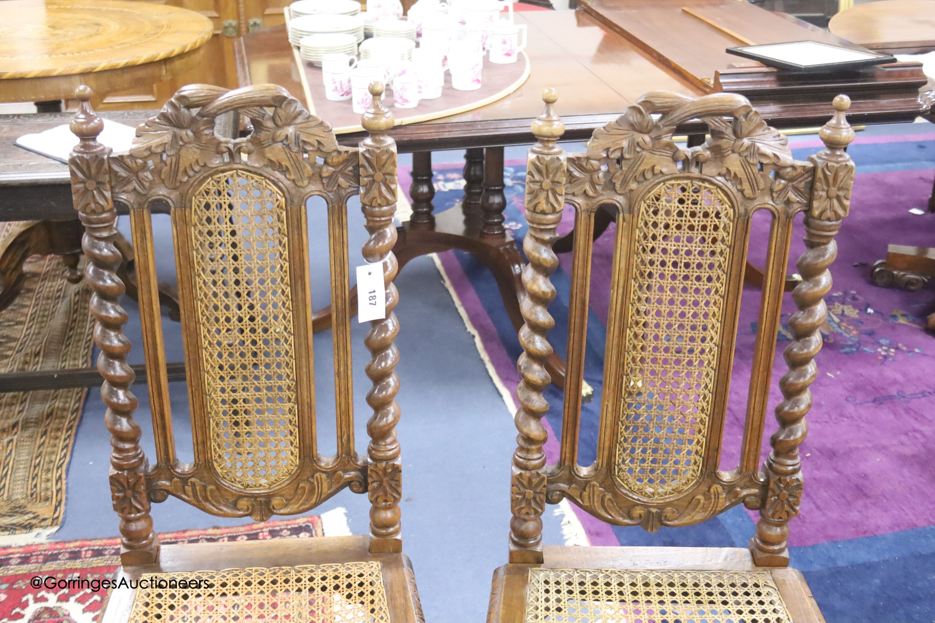 A set of twelve late Victorian caned oak dining chairs